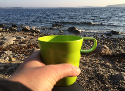 drinking cuppa joe at the beach