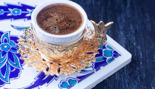 Turkish coffee in a beautiful cup and holder made without an ibrik