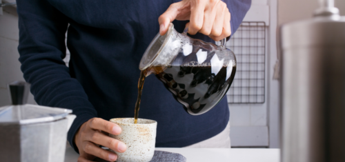 coffee being poured from a percolator tool